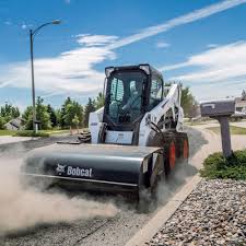 Bobcat with road sweeper